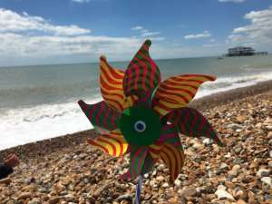 Toy windmill on beach