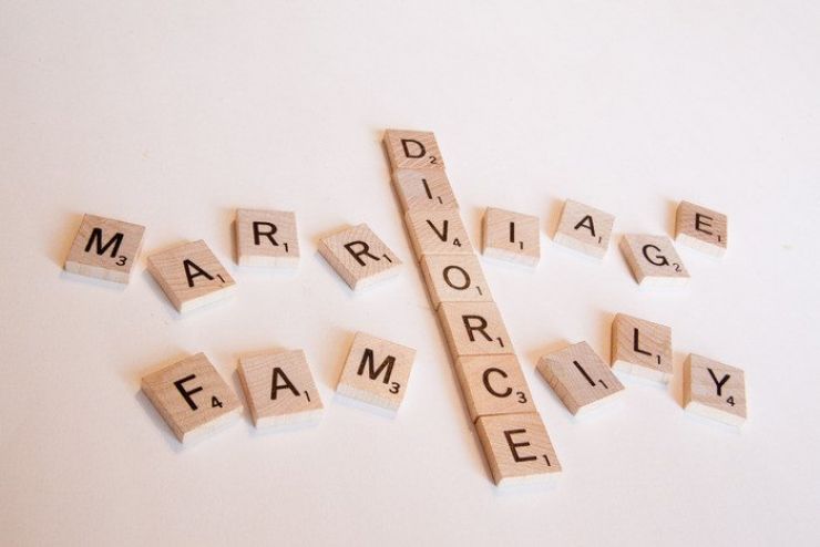 Scrabble letters spelling out divorce, marriage and family