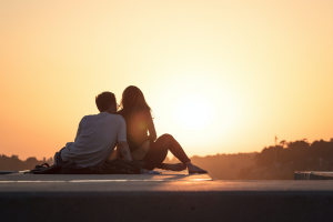 Couple sitting together on the roof