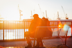 Two people sitting on a bench