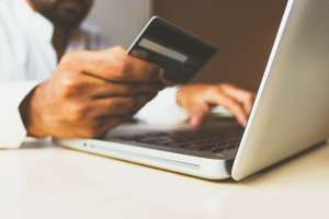 Man paying for something online using debit card